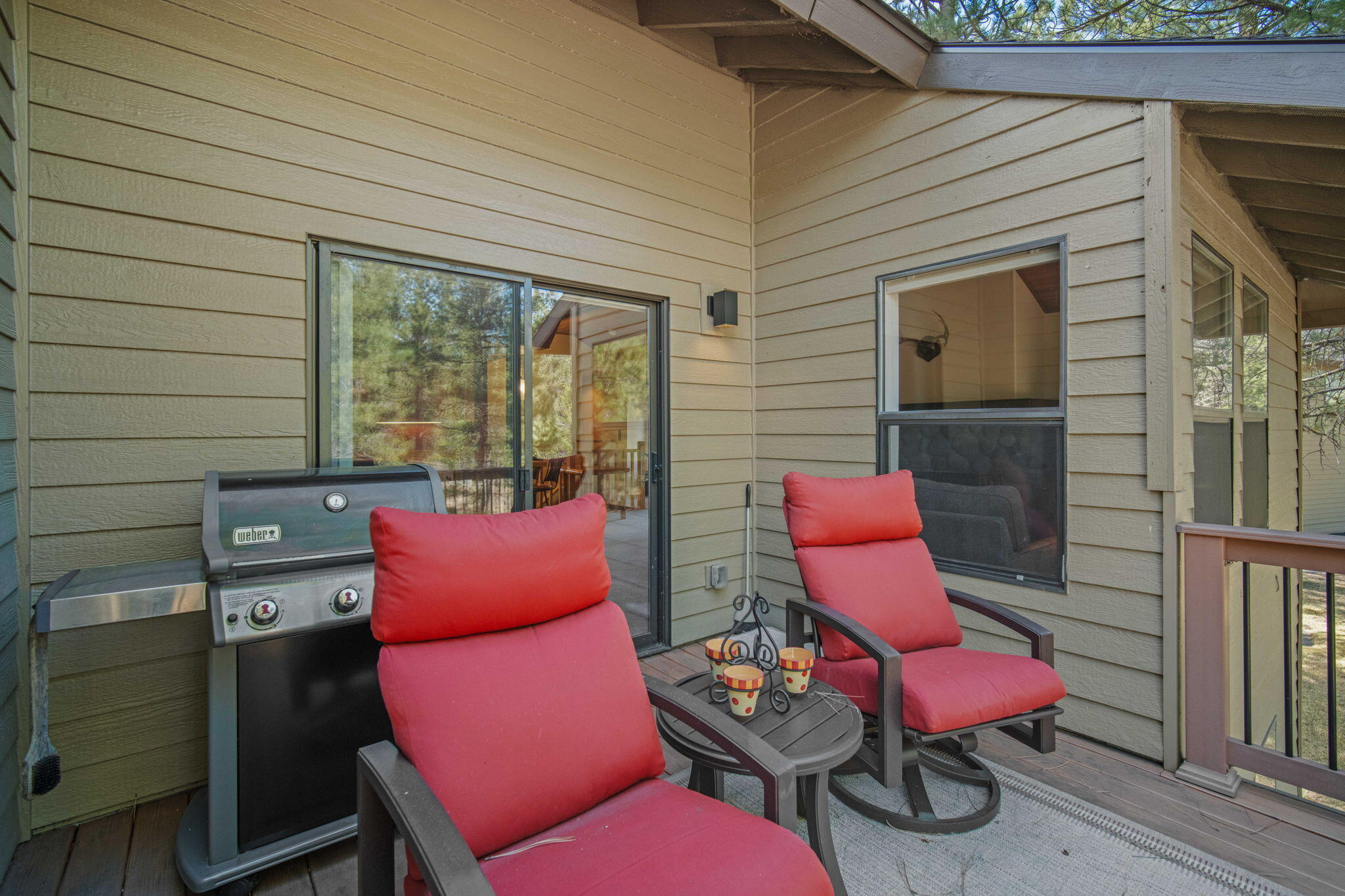 17682 Bittern Lane, Unit 31 Sunriver, OR 97707 - Photo 23 of 44 an outdoor sitting area with furniture and a chair