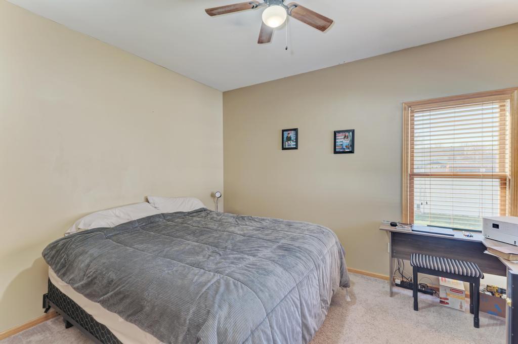 1648 Periwinkle Drive Morris, IL 60450 - Photo 13 of 40 a bedroom with a bed and a chair