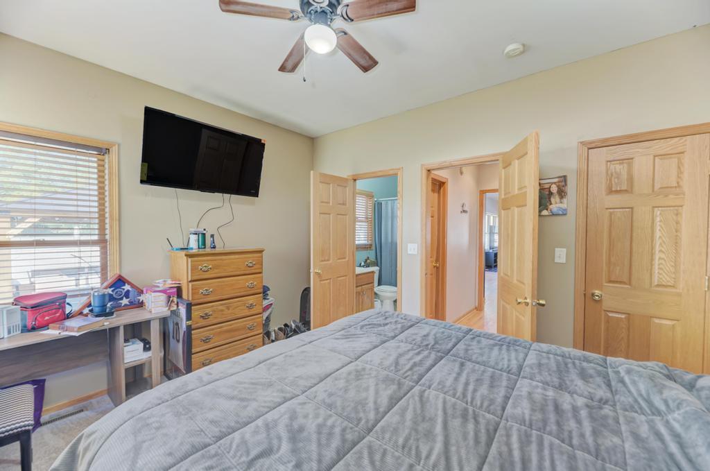 1648 Periwinkle Drive Morris, IL 60450 - Photo 14 of 40 a bedroom with a bed and flat screen tv