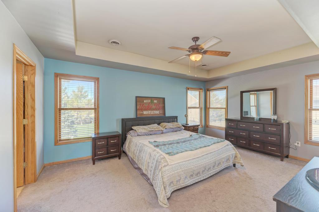 1648 Periwinkle Drive Morris, IL 60450 - Photo 20 of 40 a bedroom with a bed and dresser with mirror