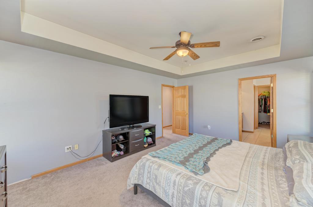 1648 Periwinkle Drive Morris, IL 60450 - Photo 21 of 40 a bedroom with a bed and a flat screen tv
