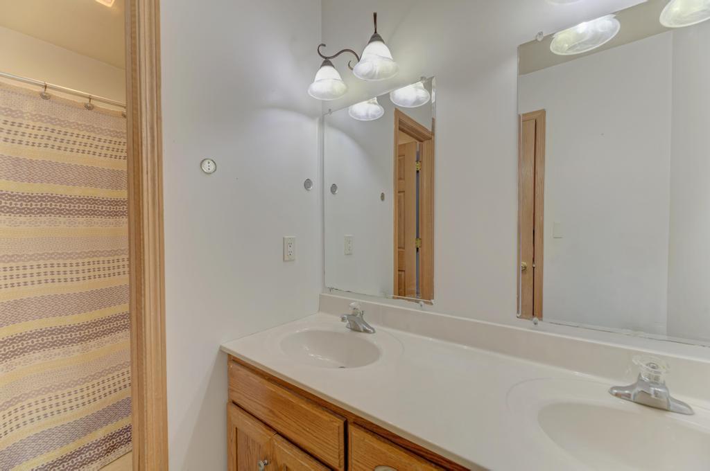 1648 Periwinkle Drive Morris, IL 60450 - Photo 26 of 40 a bathroom with a sink and a mirror