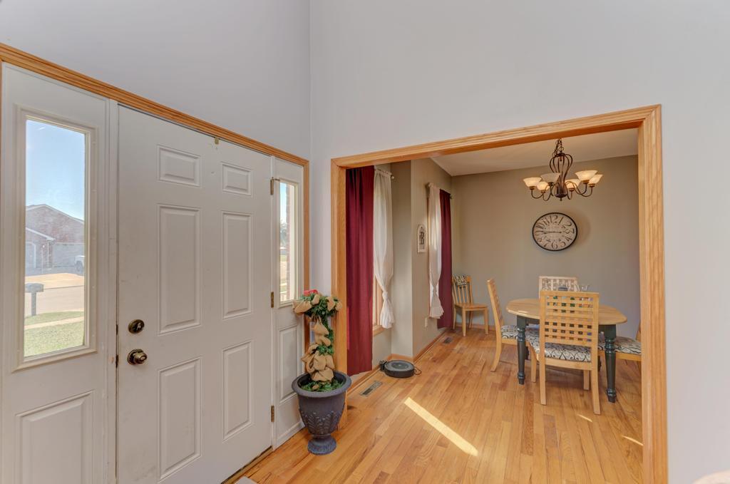 1648 Periwinkle Drive Morris, IL 60450 - Photo 4 of 40 a view of a hallway with entryway wooden floor and front door