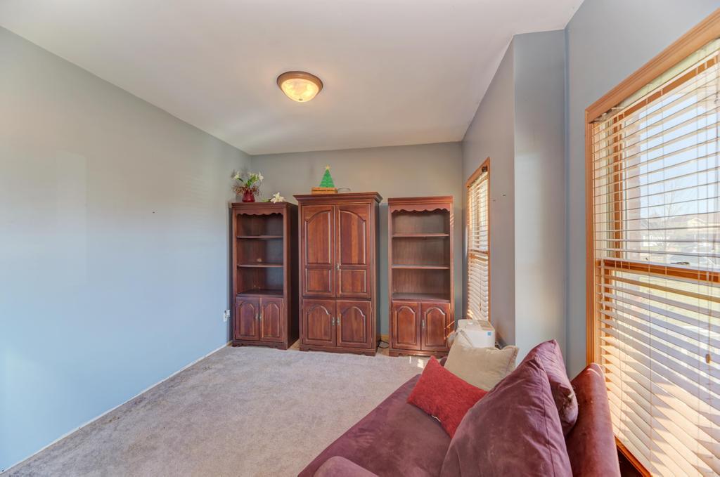 1648 Periwinkle Drive Morris, IL 60450 - Photo 6 of 40 a bedroom with a bed and wooden floor
