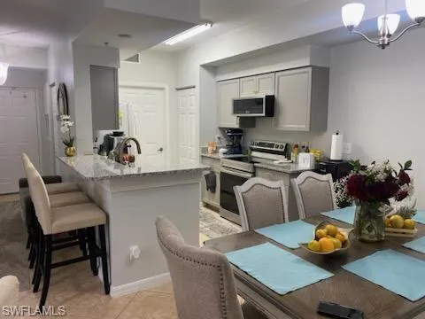 a kitchen with a dining table and chairs