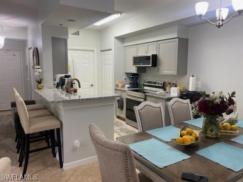 a kitchen with a dining table and chairs