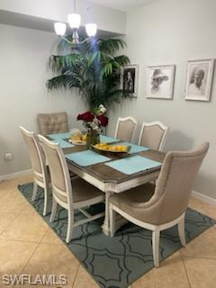 4650 St Croix Lane, Unit 726 Naples, FL 34109 - Photo 3 of 14 a view of a dining table and chairs in the patio