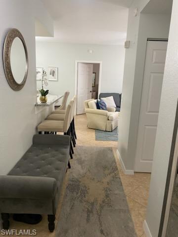 4650 St Croix Lane, Unit 726 Naples, FL 34109 - Photo 4 of 14 a living room with furniture and a window