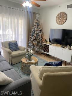 4650 St Croix Lane, Unit 726 Naples, FL 34109 - Photo 7 of 14 a living room with furniture and a large window