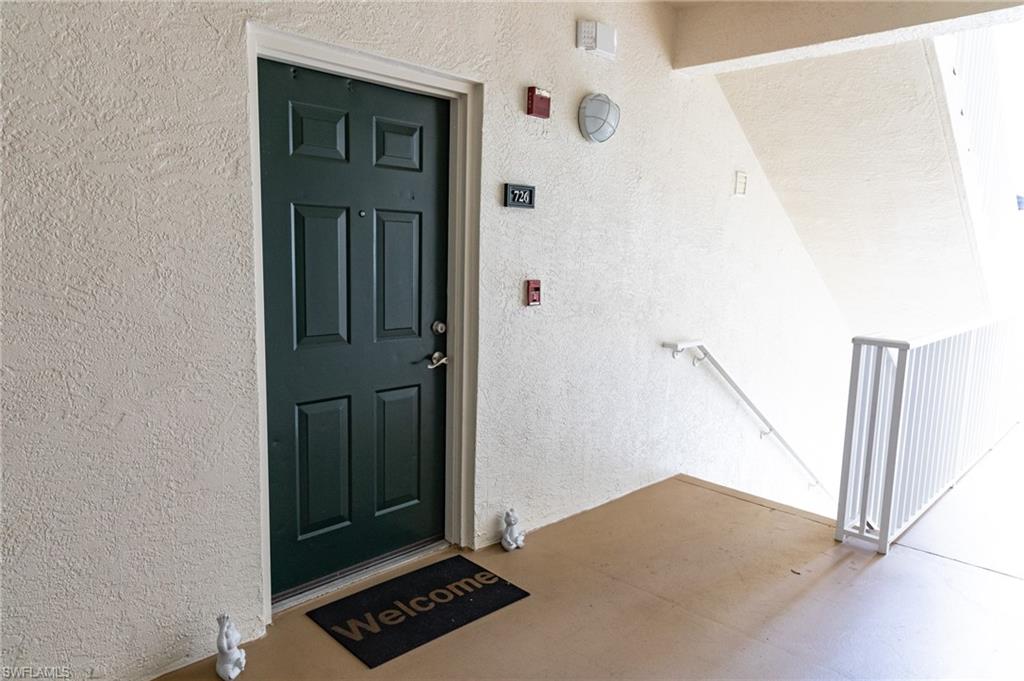 4650 St Croix Lane, Unit 726 Naples, FL 34109 - Photo 9 of 15 Property entrance featuring stucco siding