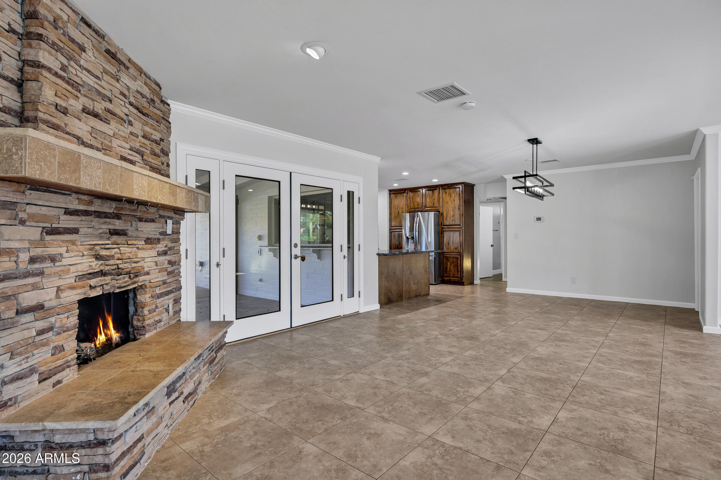 11202 North 42nd Place Phoenix, AZ 85028 - Photo 11 of 55 wooden floor fireplace and windows in an empty room