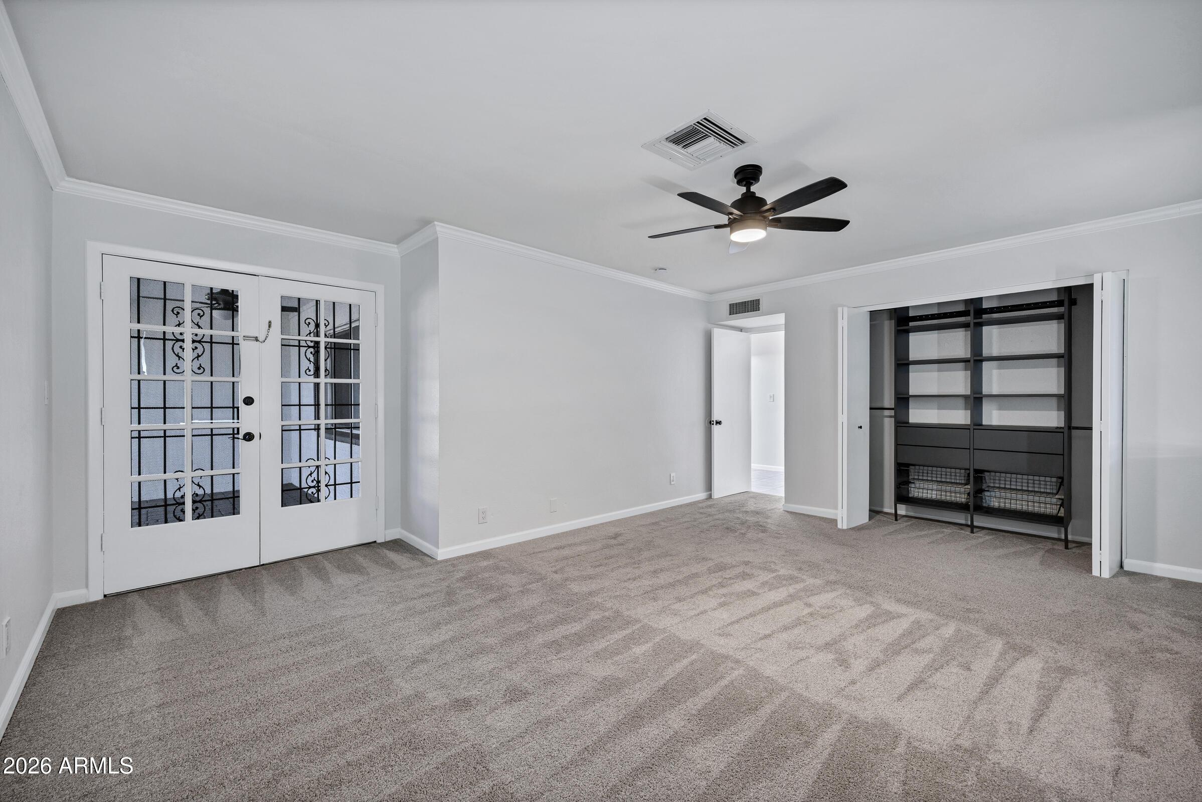 11202 North 42nd Place Phoenix, AZ 85028 - Photo 27 of 55 a view of an empty room with a window and a kitchen