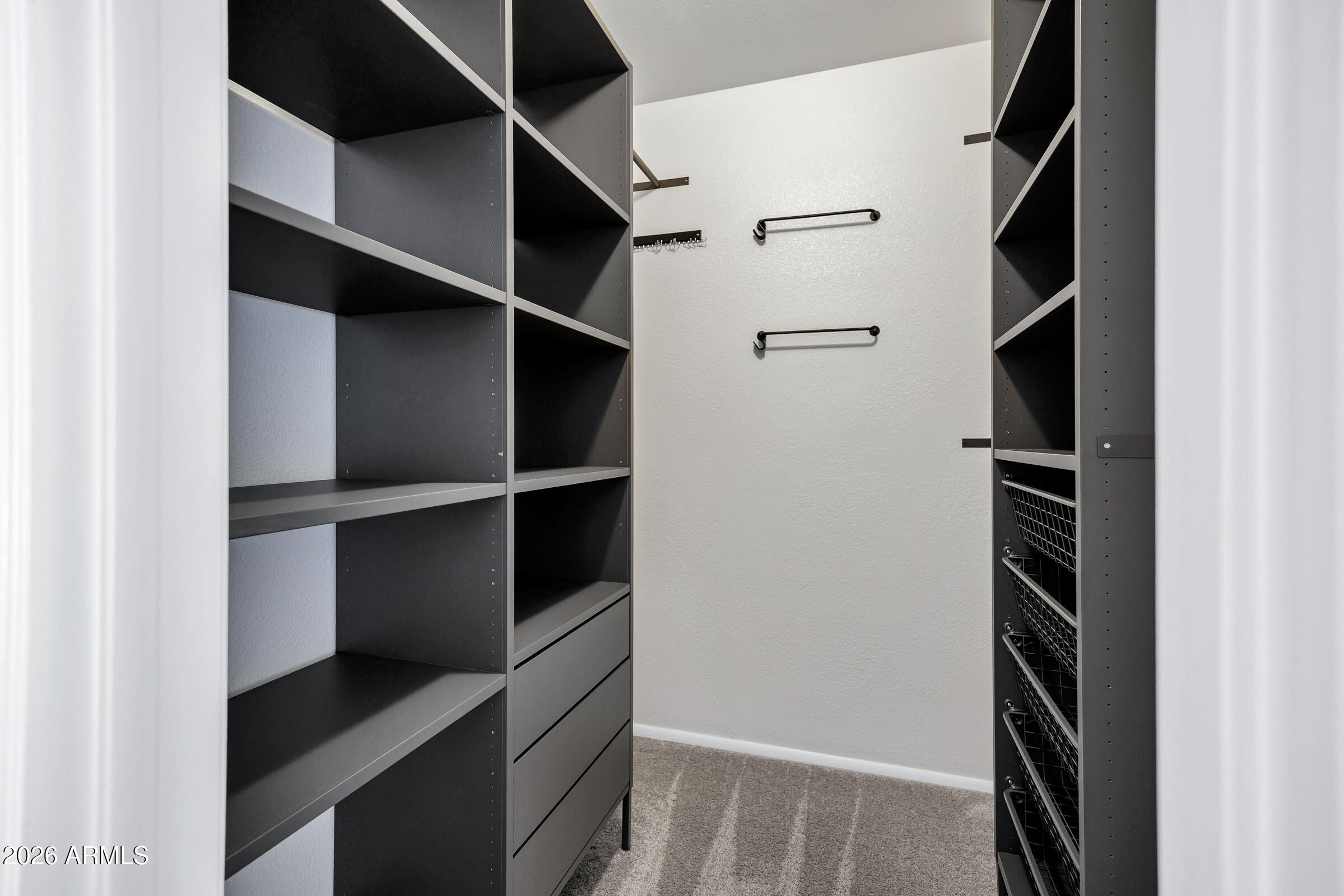 11202 North 42nd Place Phoenix, AZ 85028 - Photo 30 of 55 a view of walk in closet with empty racks