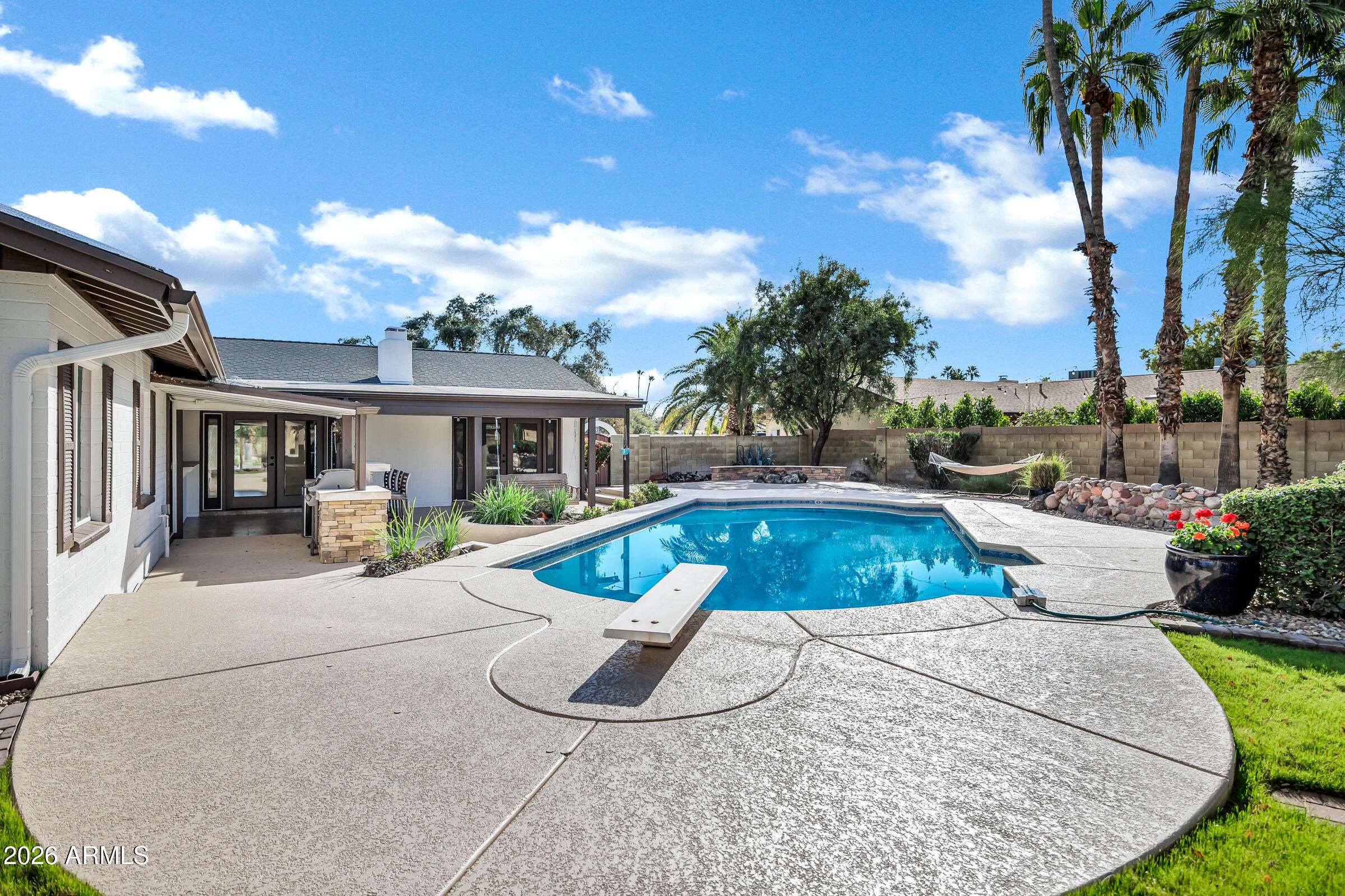 11202 North 42nd Place Phoenix, AZ 85028 - Photo 41 of 55 a view of a house with swimming pool and sitting area