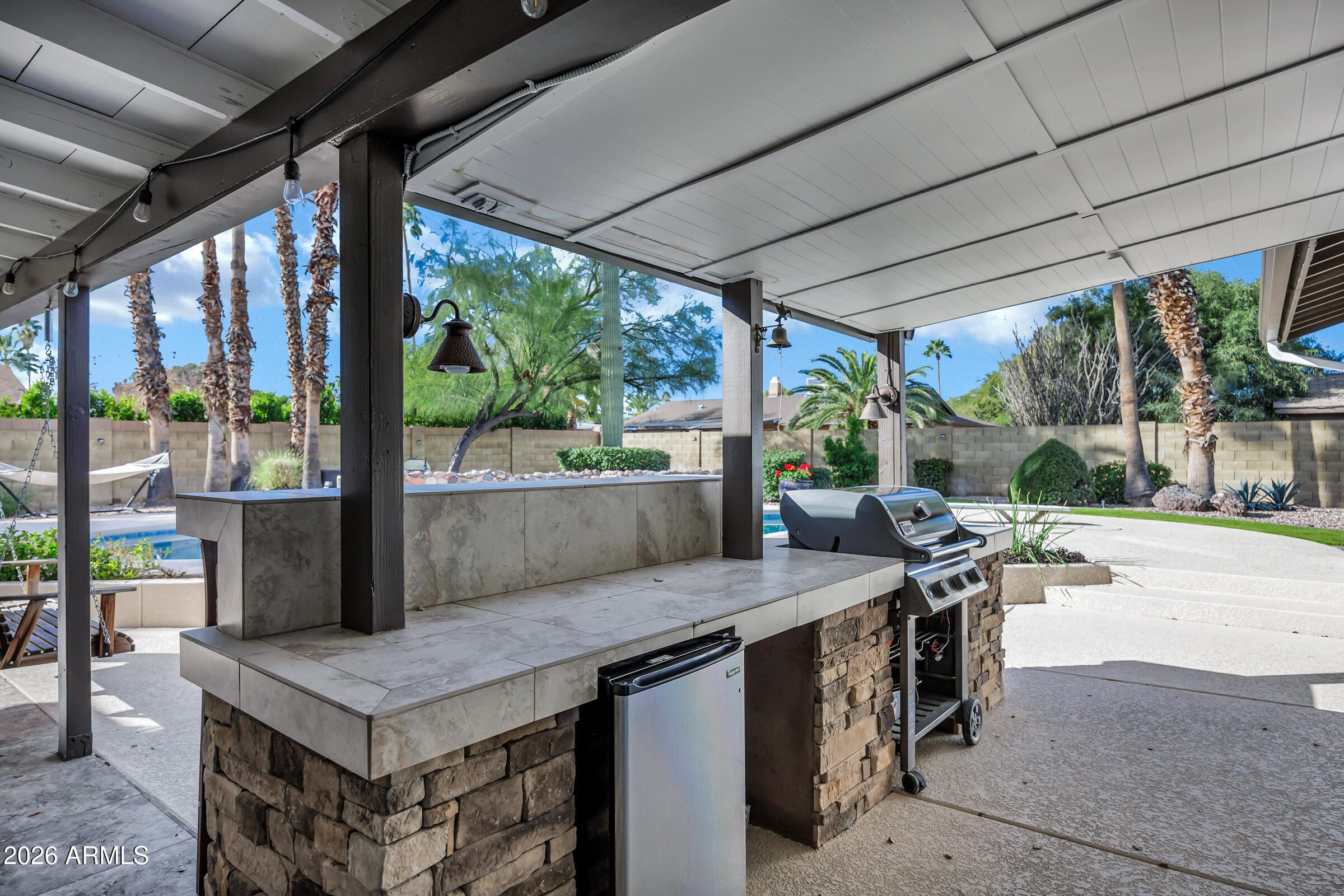 11202 North 42nd Place Phoenix, AZ 85028 - Photo 44 of 55 a view of an outdoor dining space with a table and chairs
