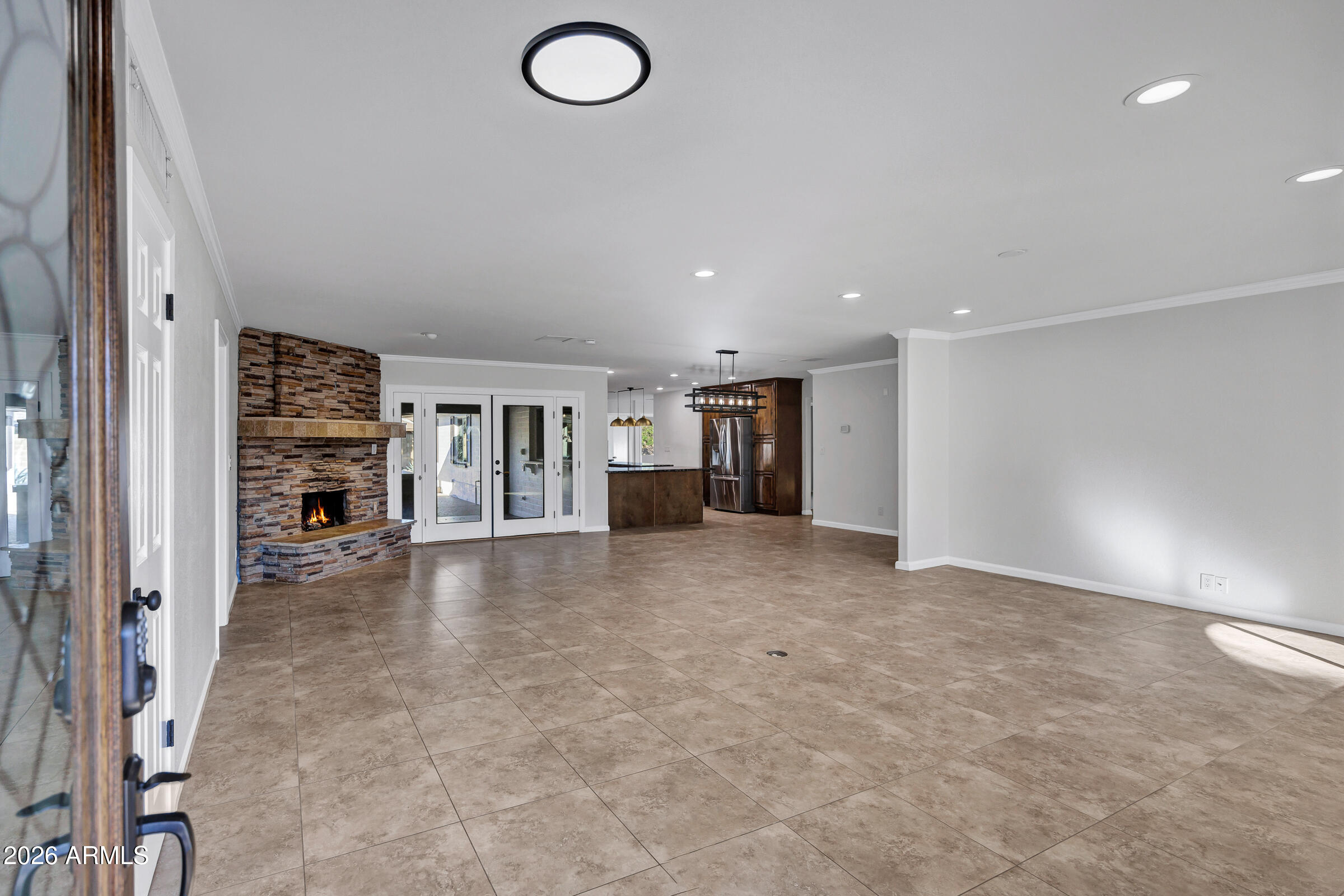 11202 North 42nd Place Phoenix, AZ 85028 - Photo 6 of 55 an empty room with fireplace and cabinet