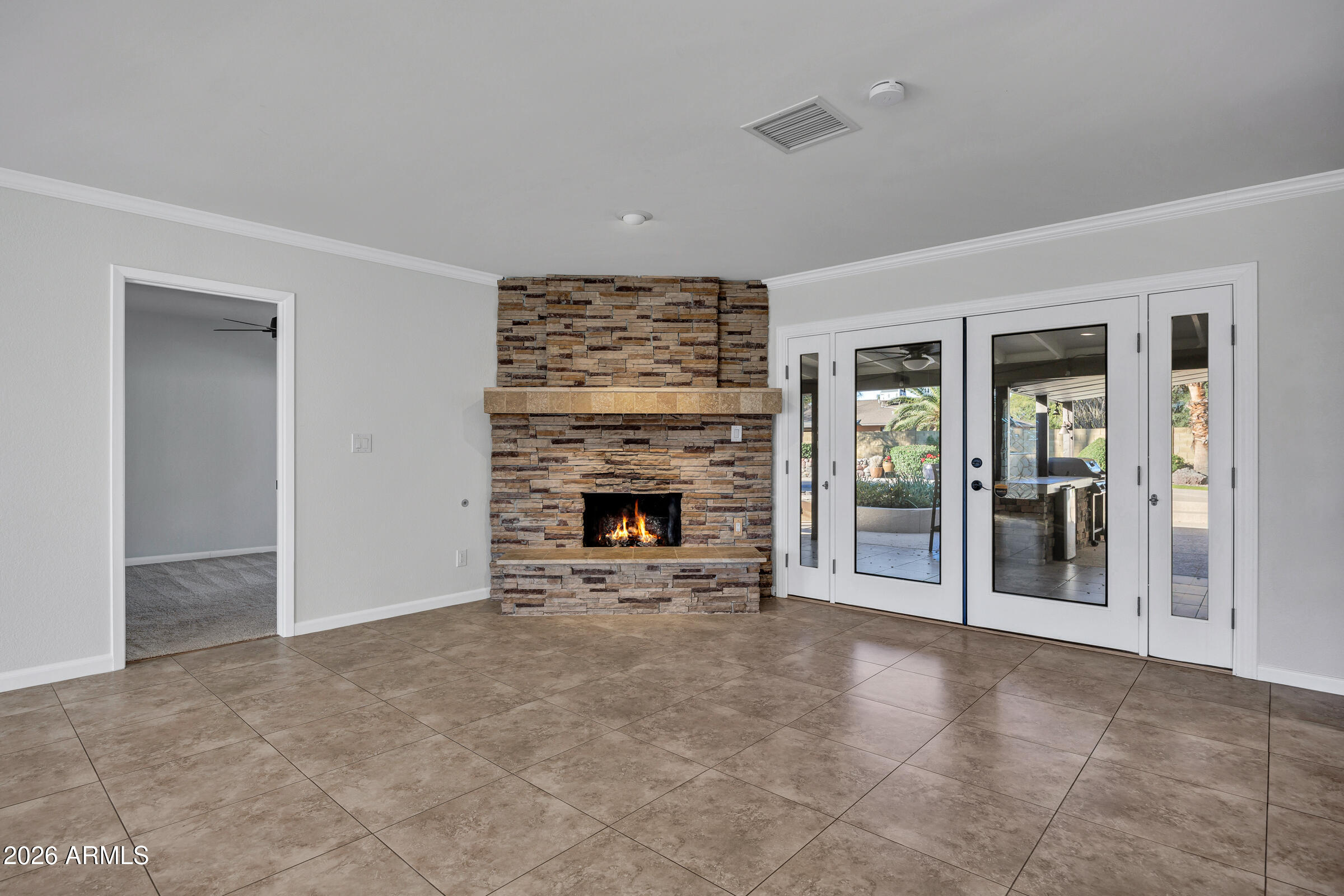 11202 North 42nd Place Phoenix, AZ 85028 - Photo 10 of 55 an empty room with windows and fireplace