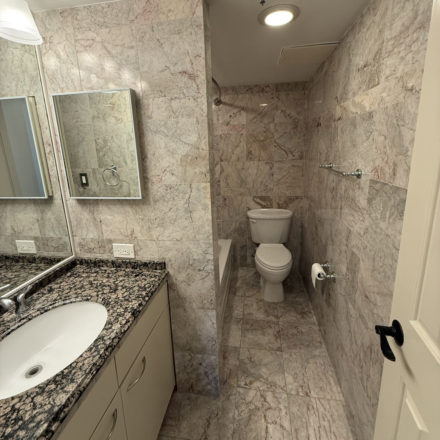 3525 Sage Road, Unit 716 Houston, TX 77056 - Photo 16 of 26 a bathroom with a granite countertop sink toilet and shower