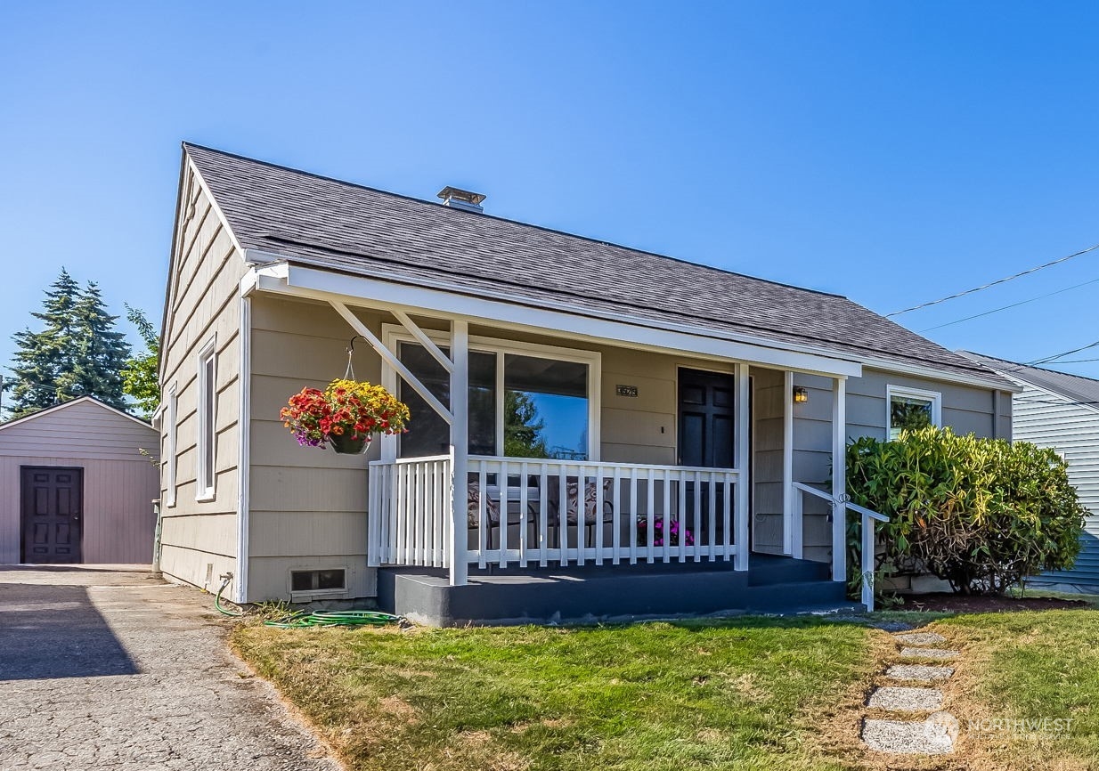 3525 Southwest Webster Street Seattle, WA 98126 - Photo 1 of 37 a view of front of a house with a yard