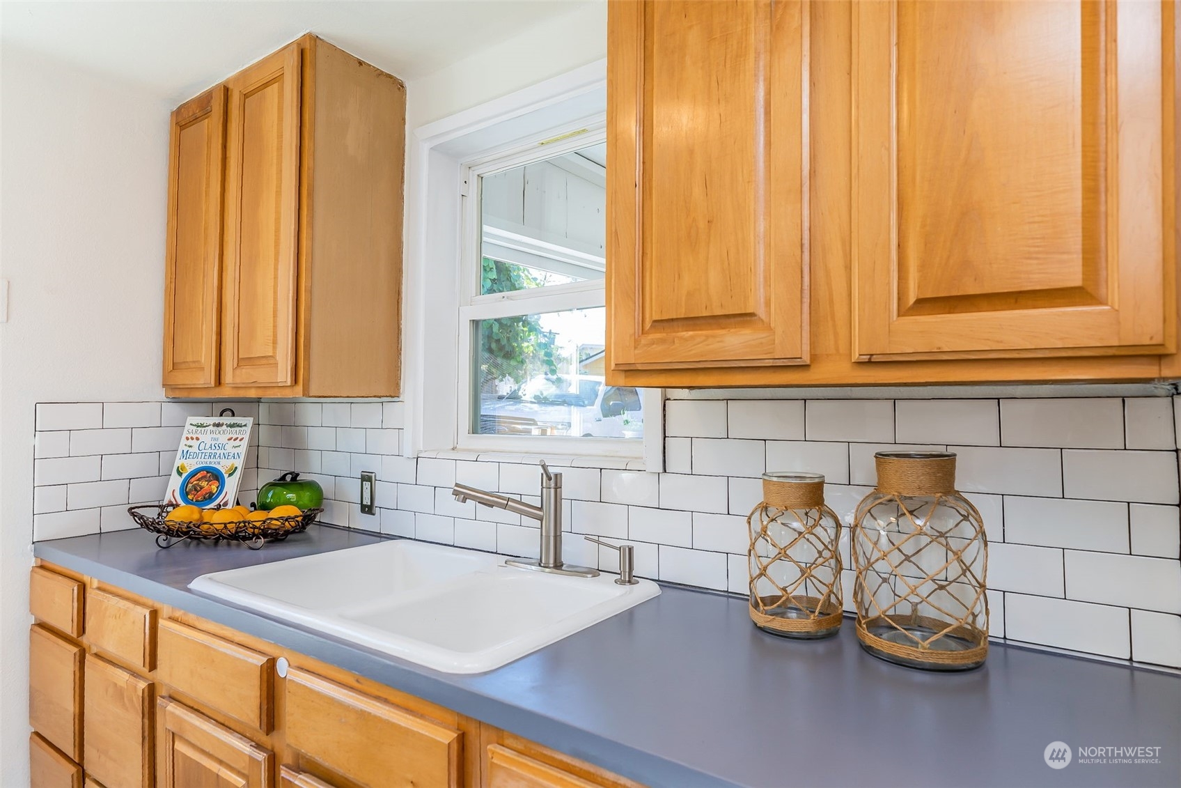 3525 Southwest Webster Street Seattle, WA 98126 - Photo 13 of 37 a kitchen with stainless steel appliances a sink a stove and a window