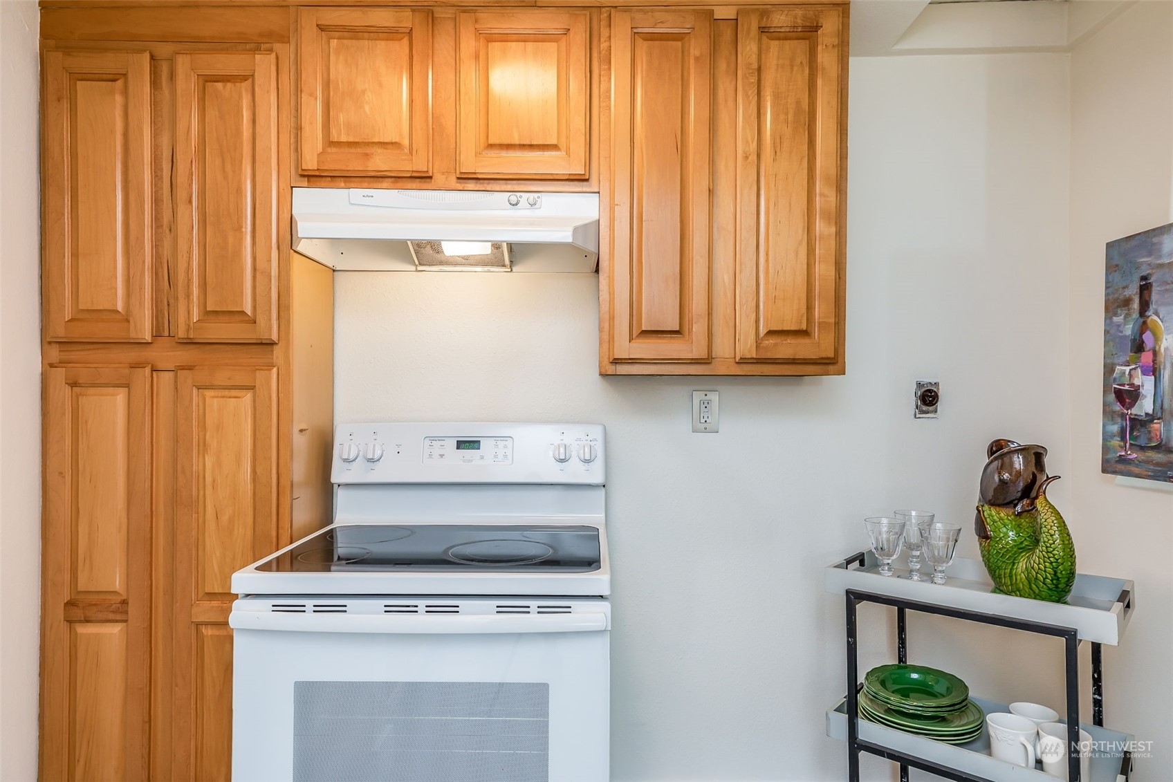 3525 Southwest Webster Street Seattle, WA 98126 - Photo 14 of 37 a stove top oven sitting inside of a kitchen
