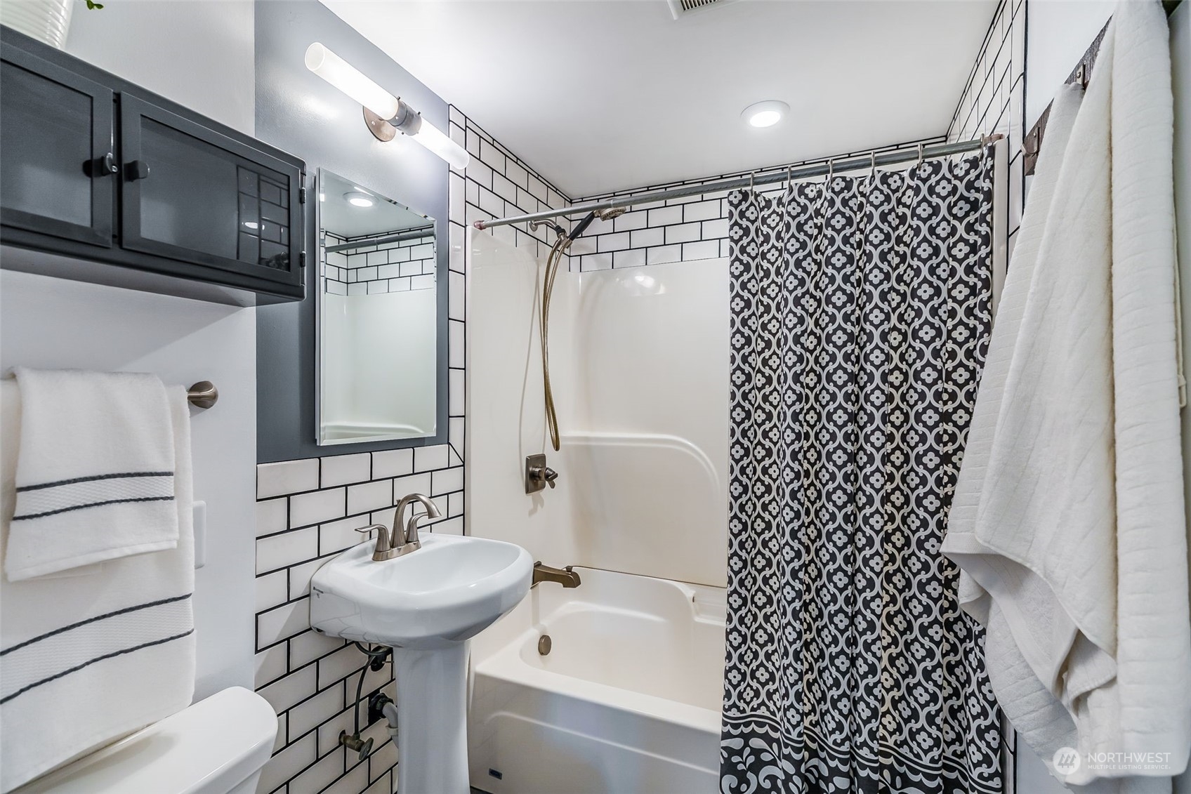 3525 Southwest Webster Street Seattle, WA 98126 - Photo 17 of 37 a bathroom with a sink toilet and shower