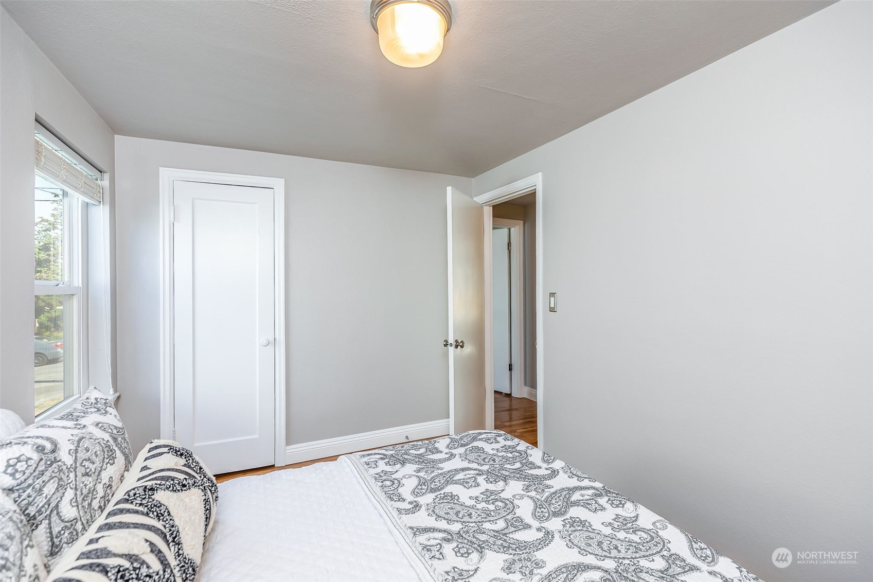 3525 Southwest Webster Street Seattle, WA 98126 - Photo 22 of 37 a bedroom with a bed and a window