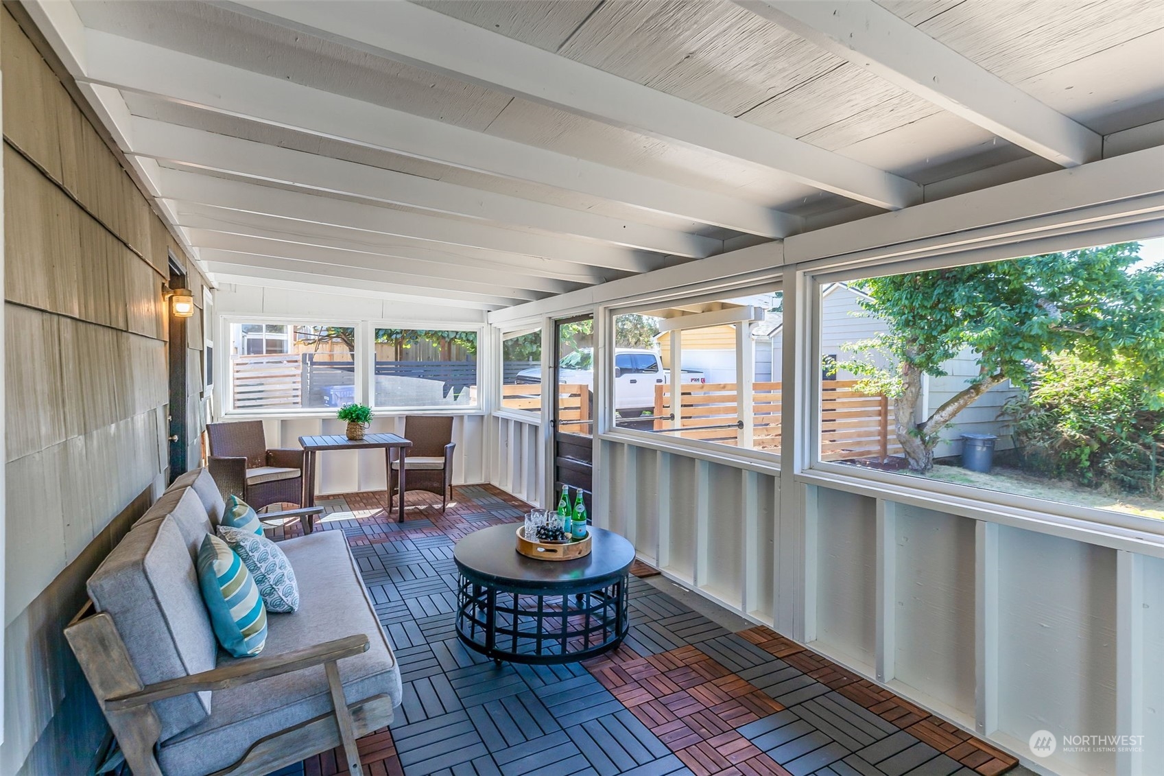 3525 Southwest Webster Street Seattle, WA 98126 - Photo 30 of 37 a living room with furniture and a floor to ceiling window