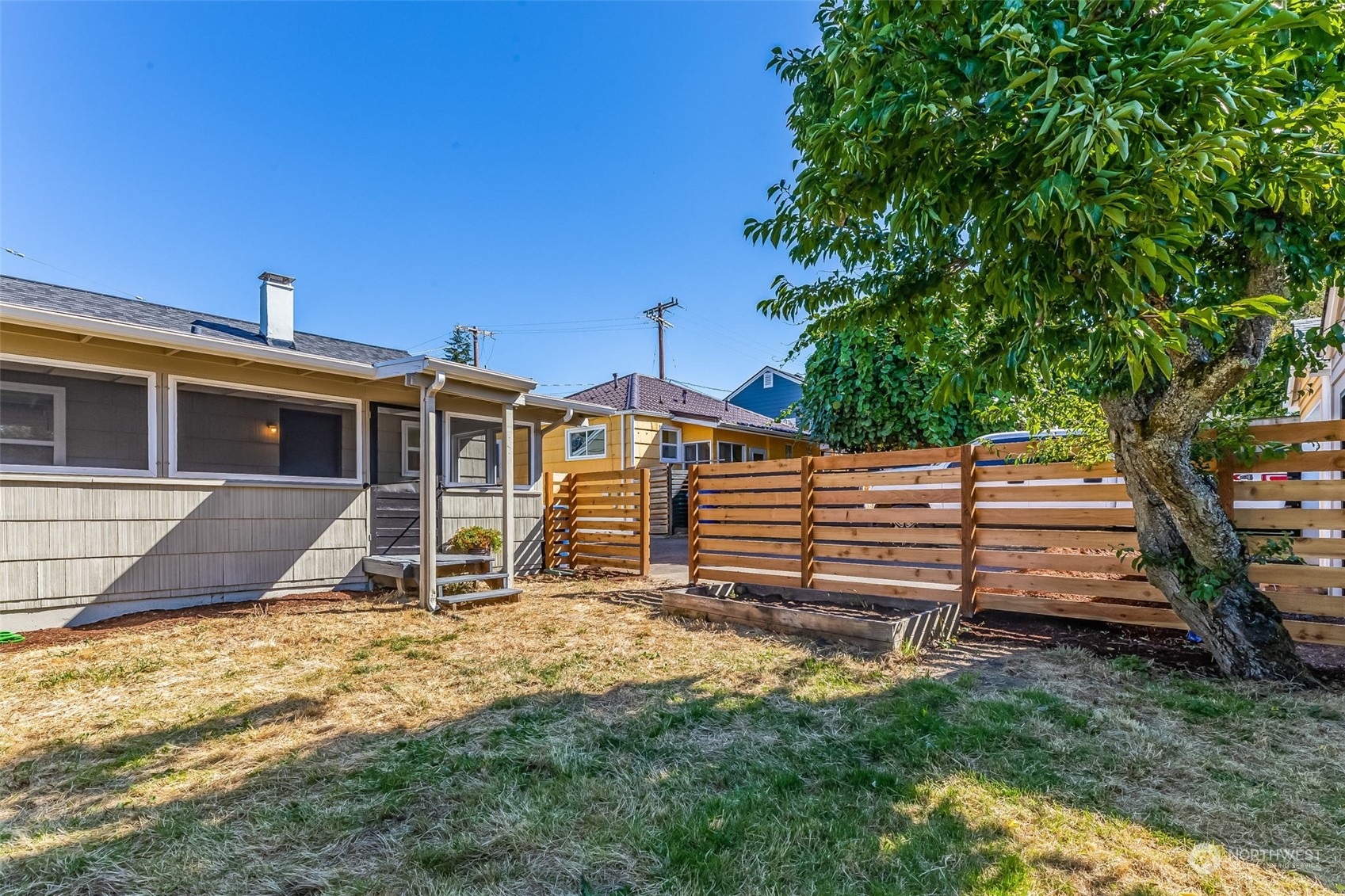 3525 Southwest Webster Street Seattle, WA 98126 - Photo 35 of 37 a front view of a house with a yard