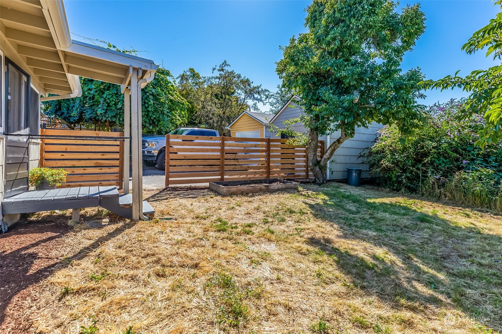 3525 Southwest Webster Street Seattle, WA 98126 - Photo 36 of 37 a view of a backyard with a small cabin