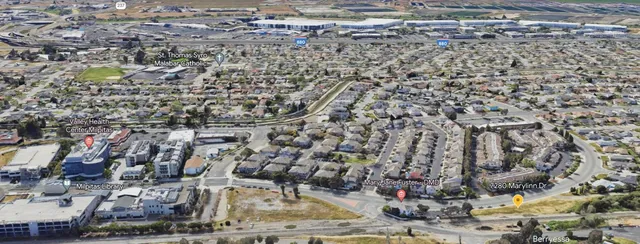 an aerial view of residential houses with outdoor space