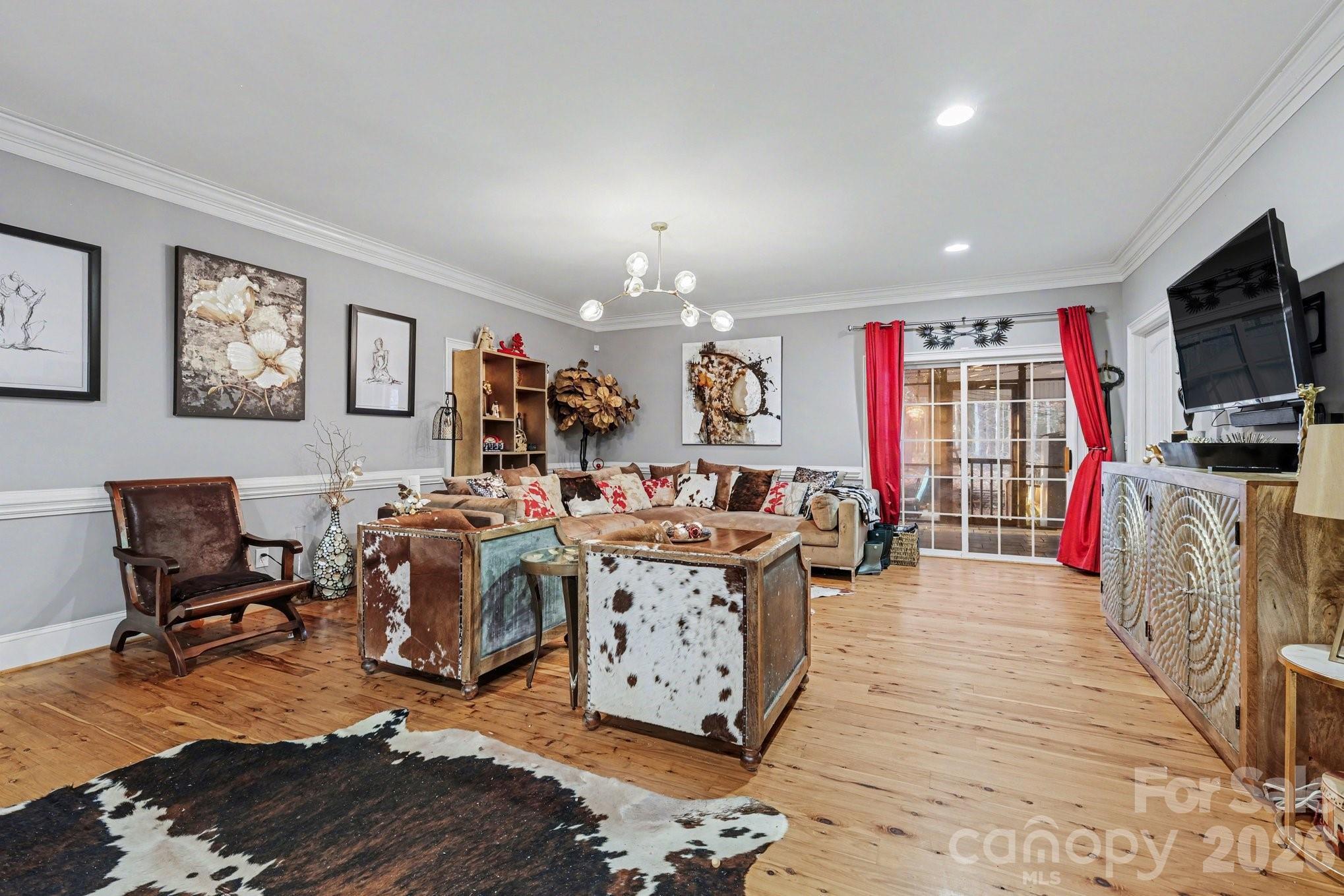 105 Eubanks Road Monroe, NC 28112 - Photo 13 of 41 a living room with furniture and a flat screen tv