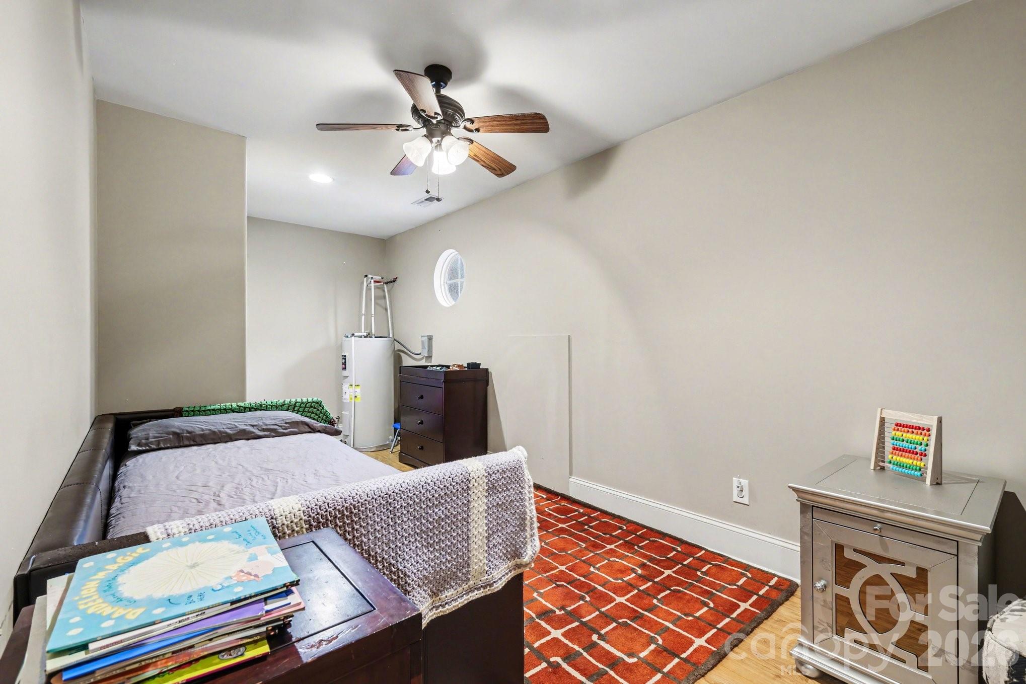 105 Eubanks Road Monroe, NC 28112 - Photo 23 of 41 a bedroom with a bed and wooden floor