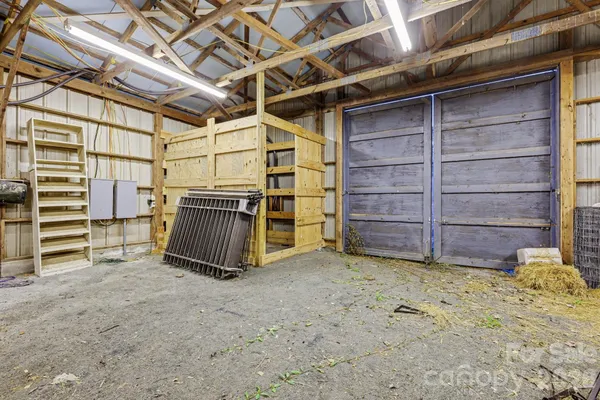 a view of an empty room with a staircase