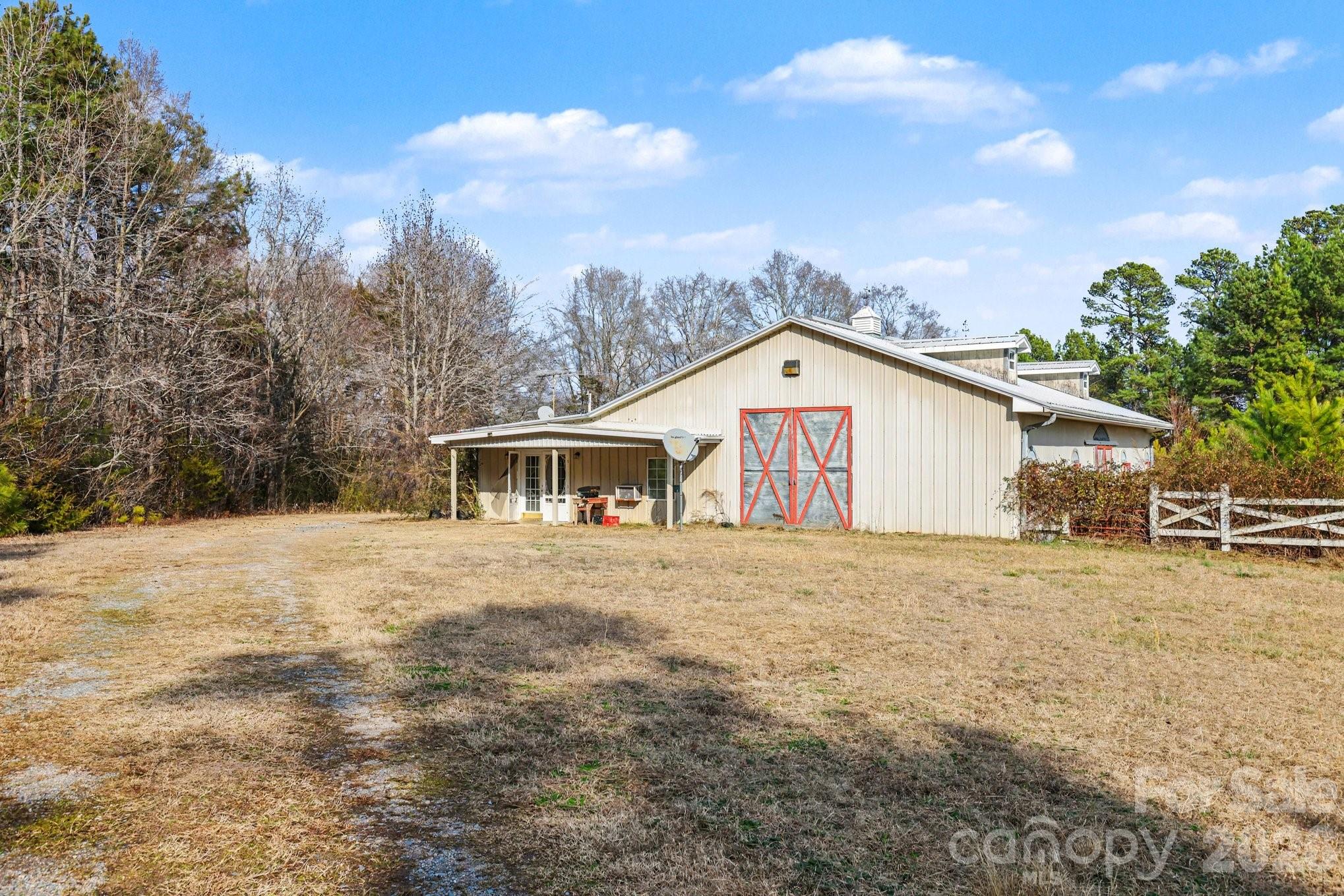 105 Eubanks Road Monroe, NC 28112 - Photo 30 of 41 a house with trees in the background