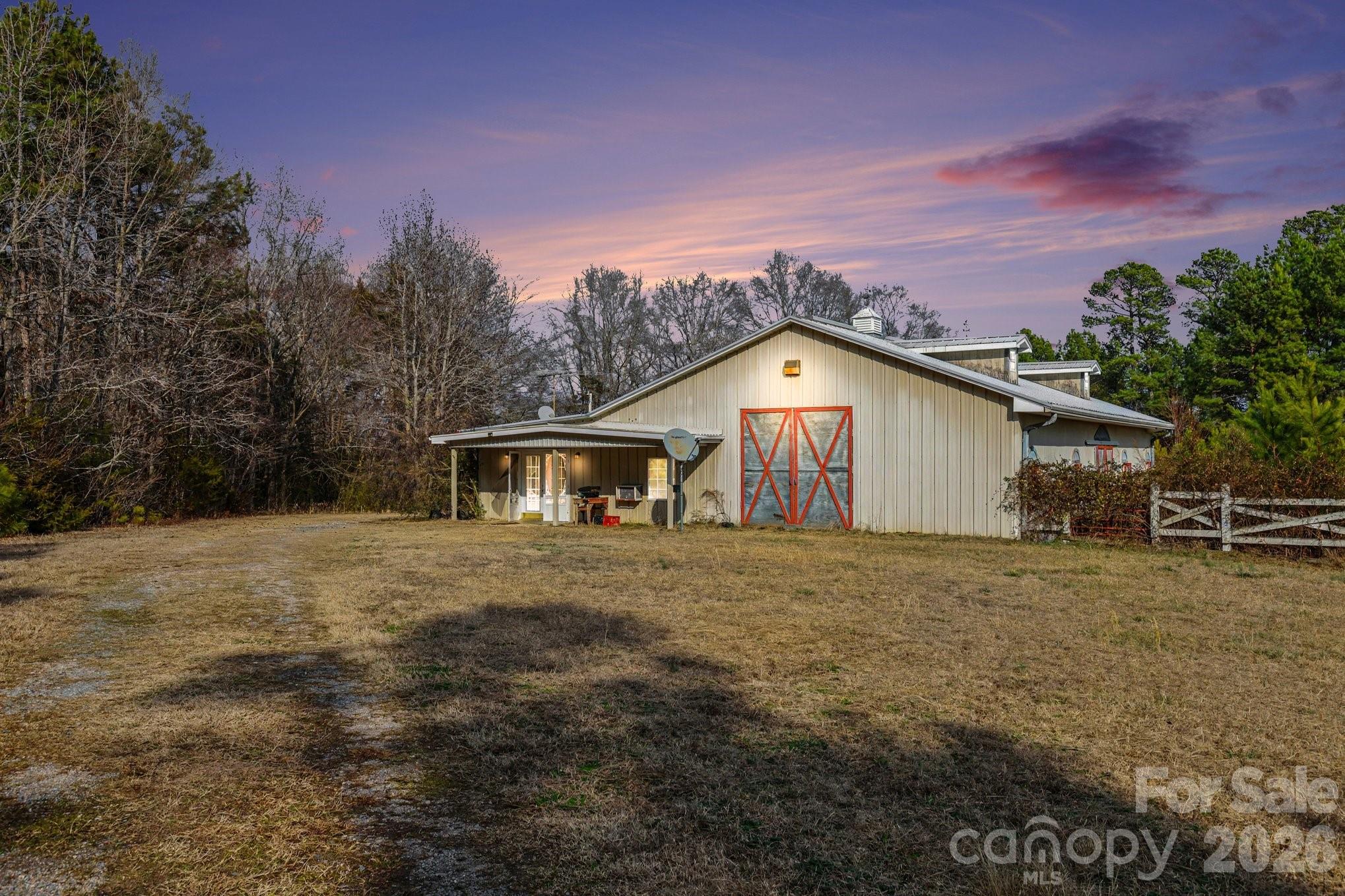 105 Eubanks Road Monroe, NC 28112 - Photo 3 of 41 a house with trees in the background
