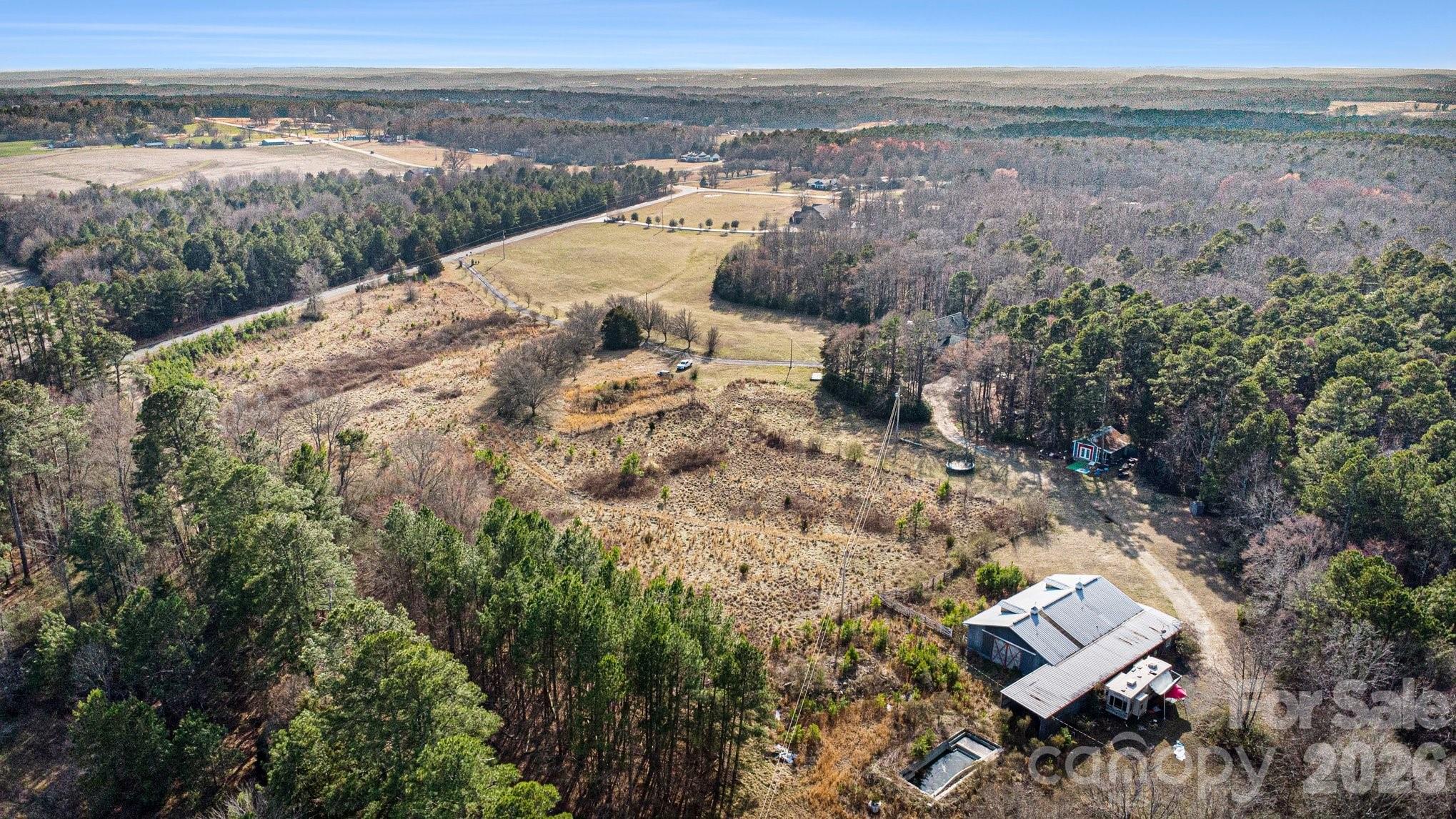 105 Eubanks Road Monroe, NC 28112 - Photo 36 of 41 a view of a dry yard with wooden fence