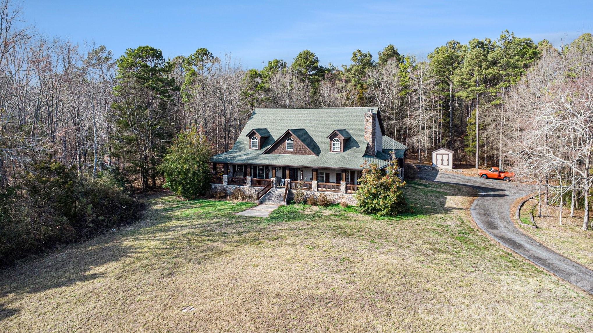 105 Eubanks Road Monroe, NC 28112 - Photo 4 of 41 a view of a house with a big yard and large trees
