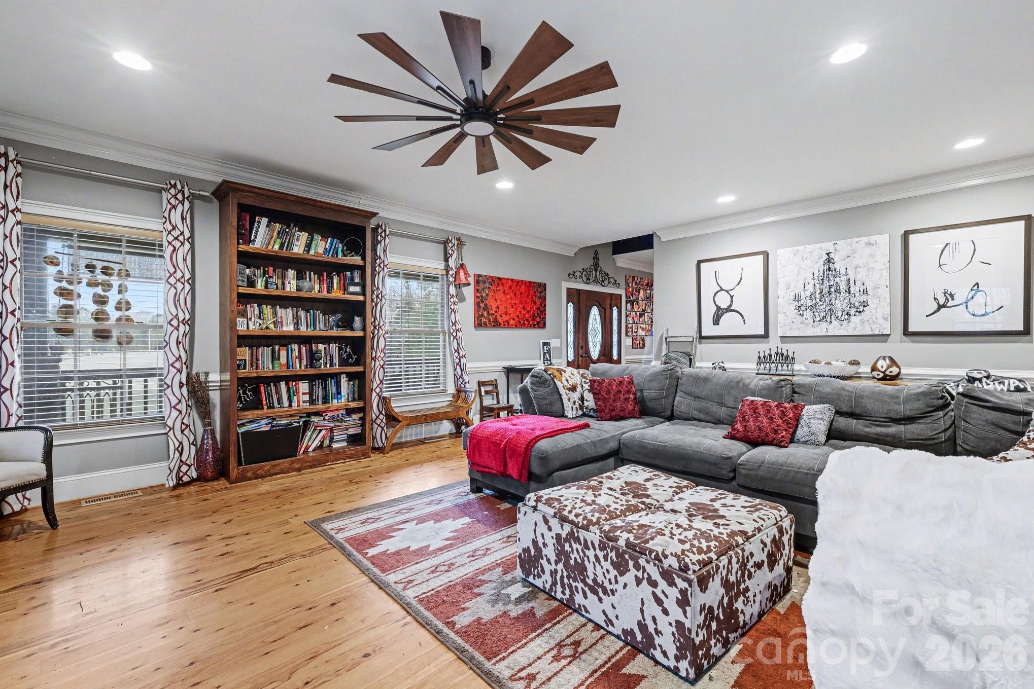 105 Eubanks Road Monroe, NC 28112 - Photo 7 of 41 a living room with furniture and a book shelf