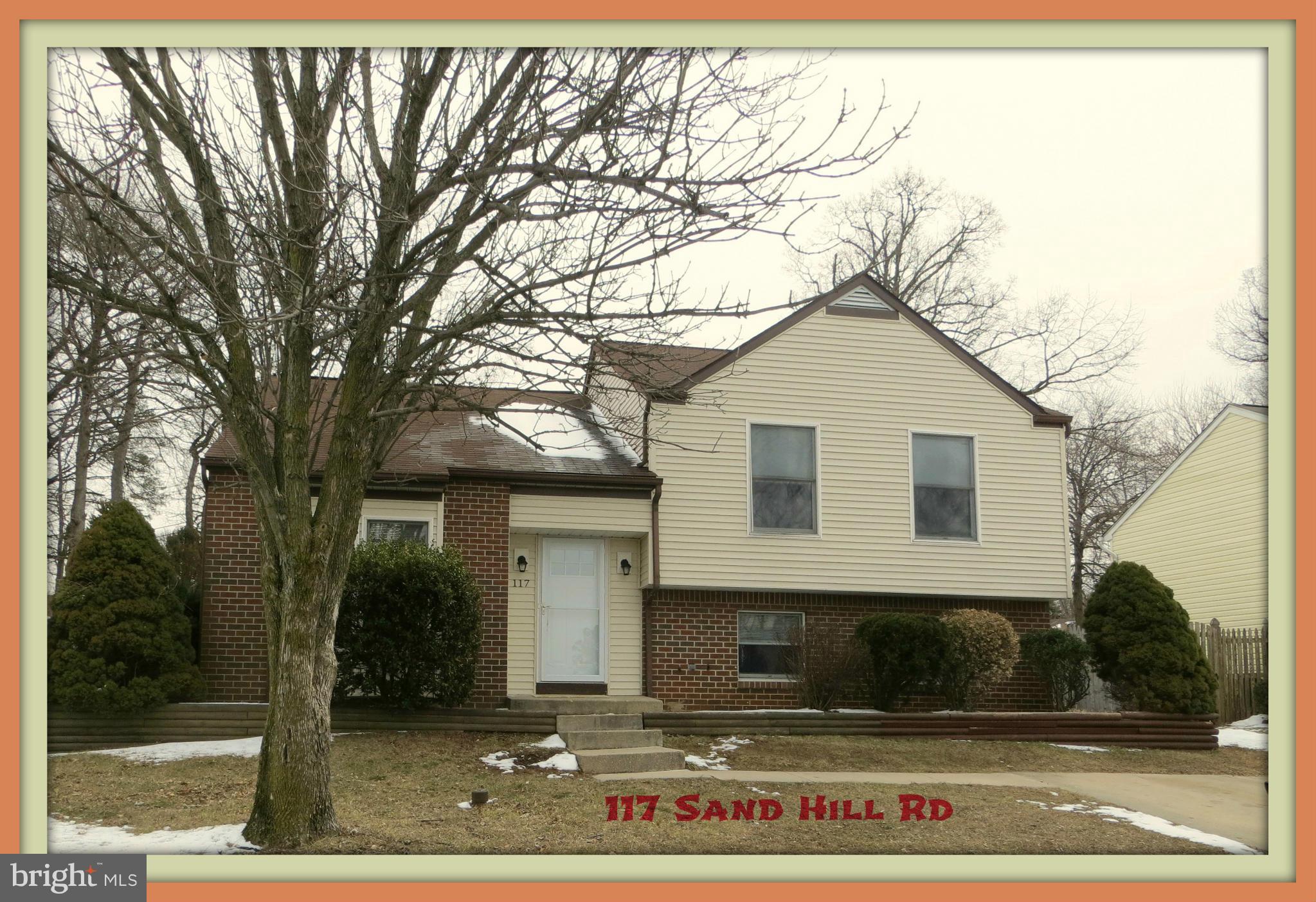 117 Sandhill Road Essex, MD 21221 - Photo 1 of 13 a front view of a house with a yard