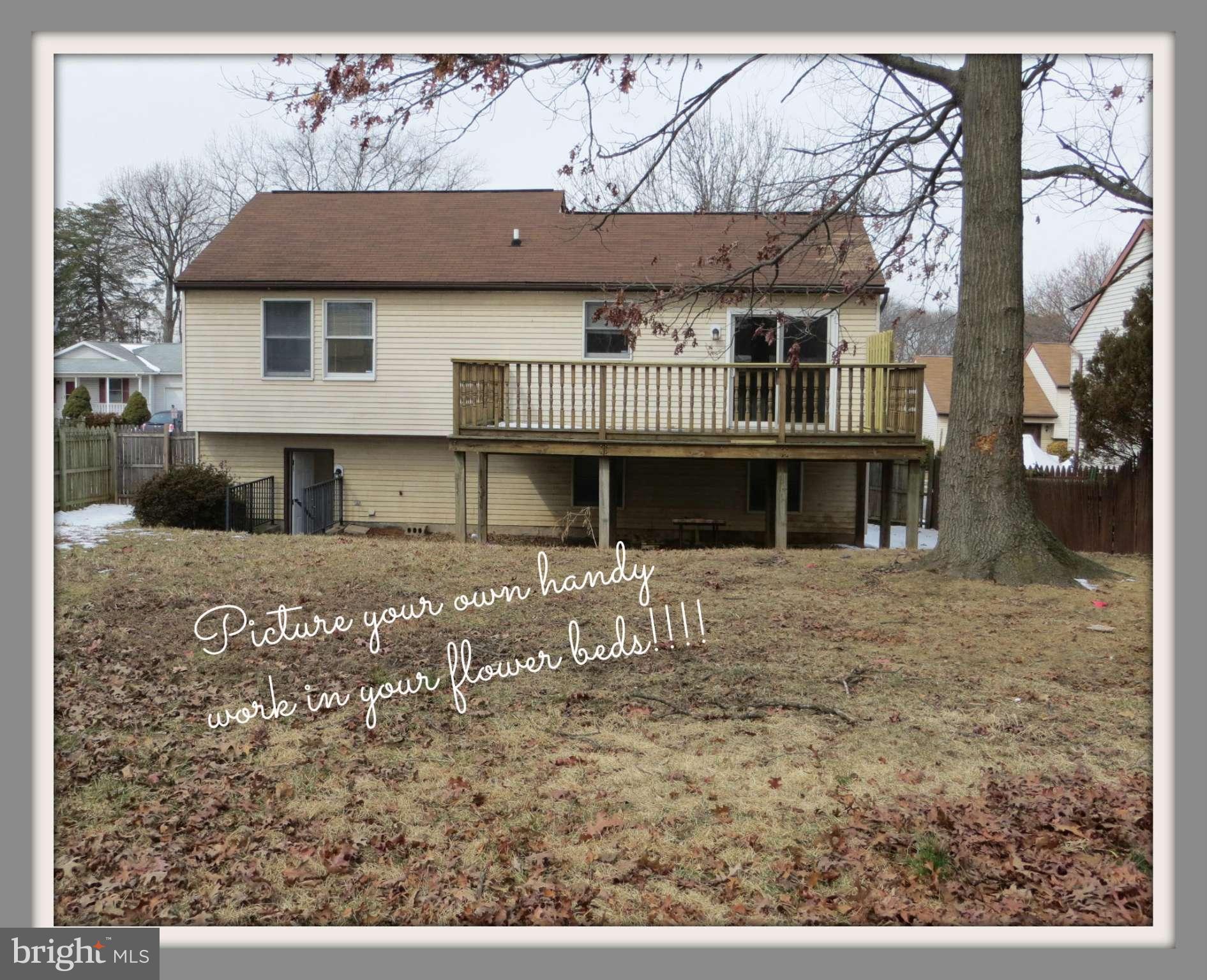 117 Sandhill Road Essex, MD 21221 - Photo 13 of 13 a front view of a house with a yard
