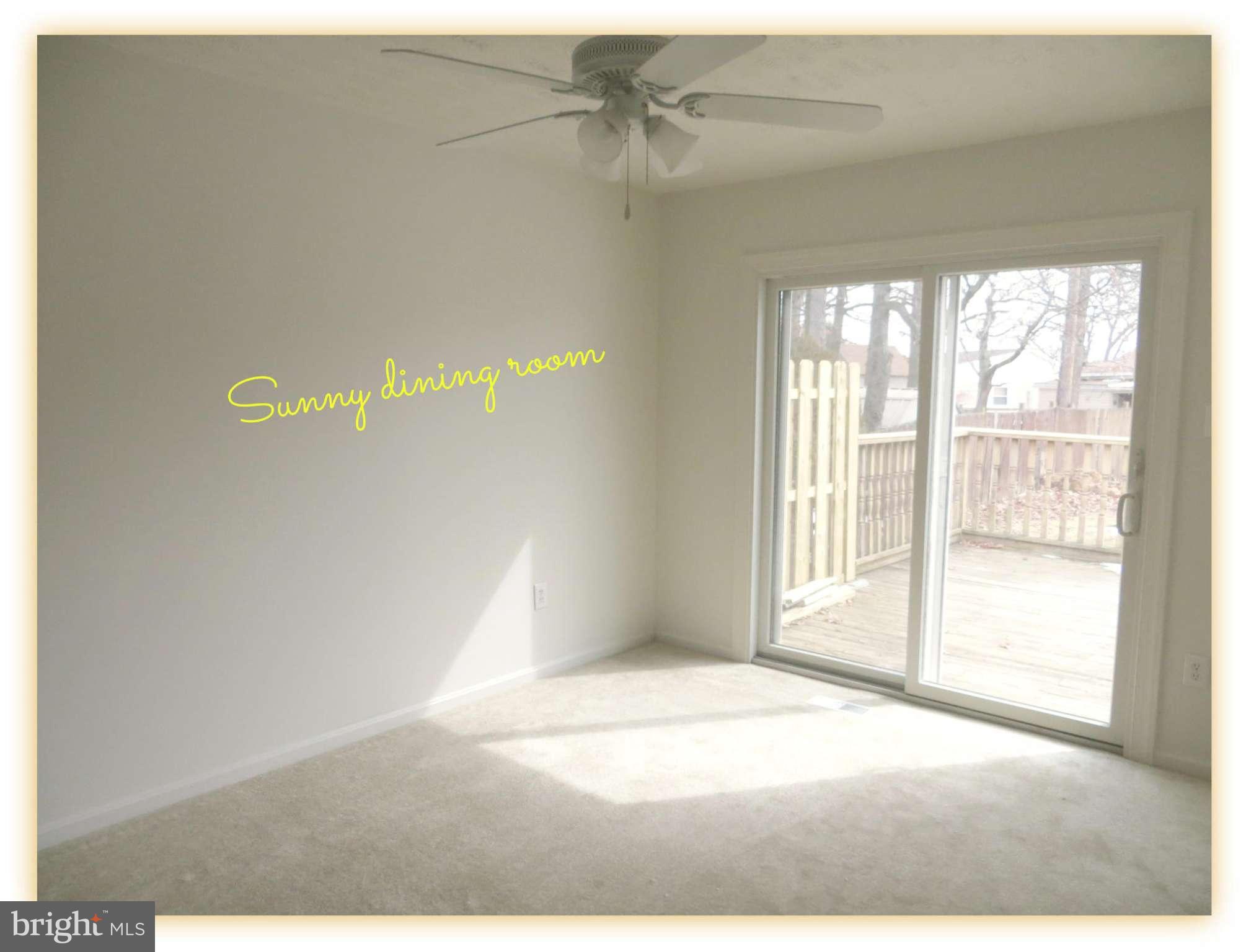 117 Sandhill Road Essex, MD 21221 - Photo 5 of 13 a view of an empty room with a window