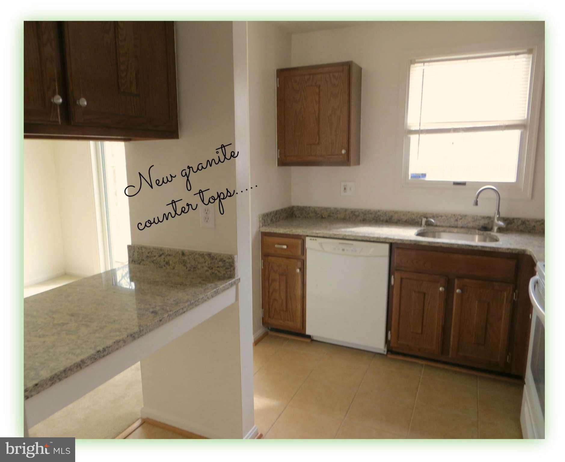 117 Sandhill Road Essex, MD 21221 - Photo 6 of 13 a kitchen with a sink and a stove