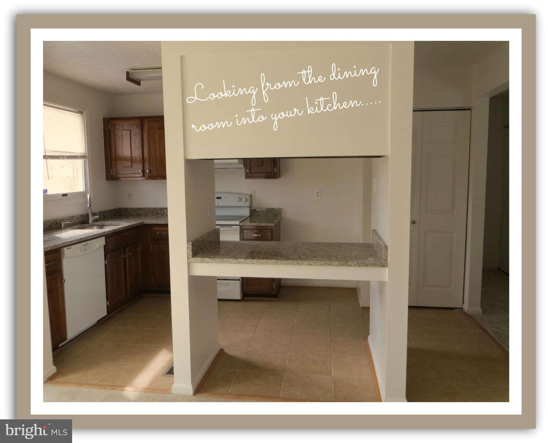 117 Sandhill Road Essex, MD 21221 - Photo 7 of 13 a bathroom with a sink a mirror and a toilet