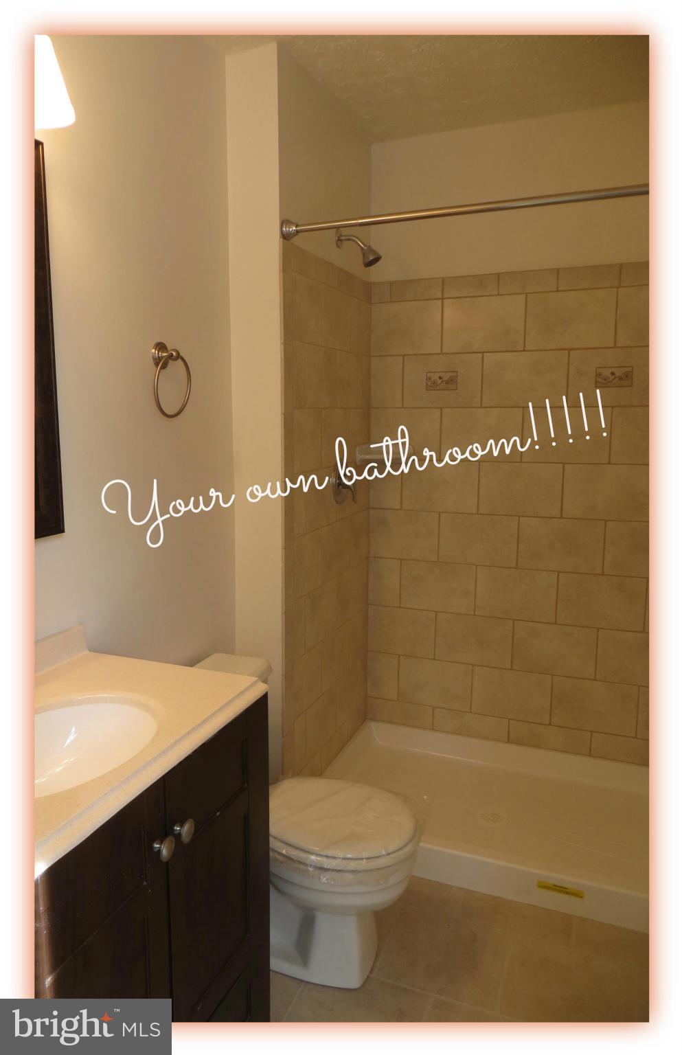 117 Sandhill Road Essex, MD 21221 - Photo 9 of 13 a bathroom with a sink a toilet and shower