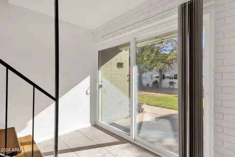 a potted plant sitting in front of a house