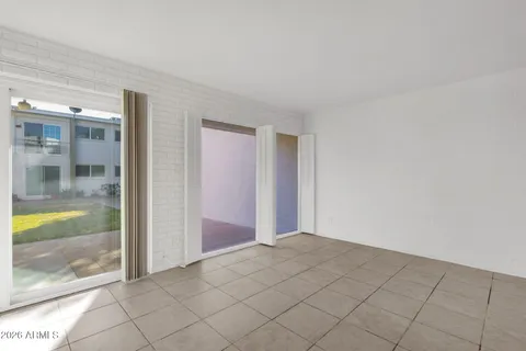 a view of an empty room with glass windows