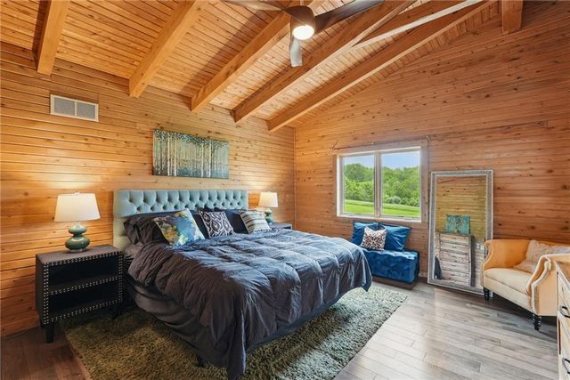 a bedroom with a bed and a couch