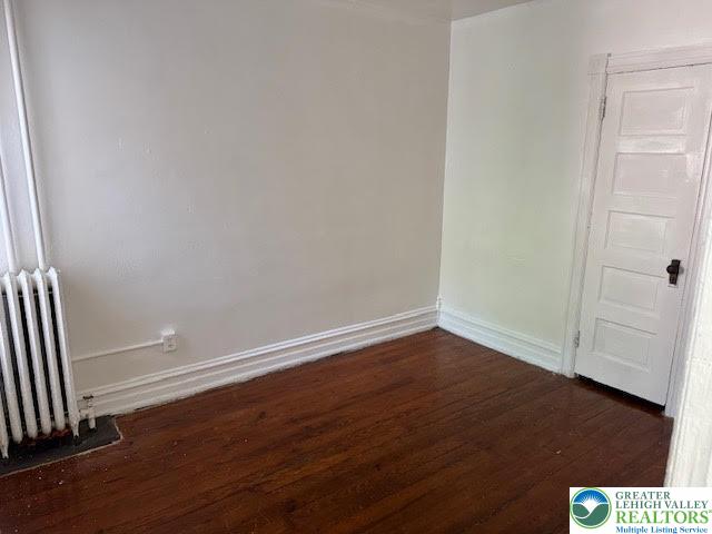 208 Ridge Avenue Allentown, PA 18102 - Photo 9 of 17 a view of an empty room with wooden floor and a window