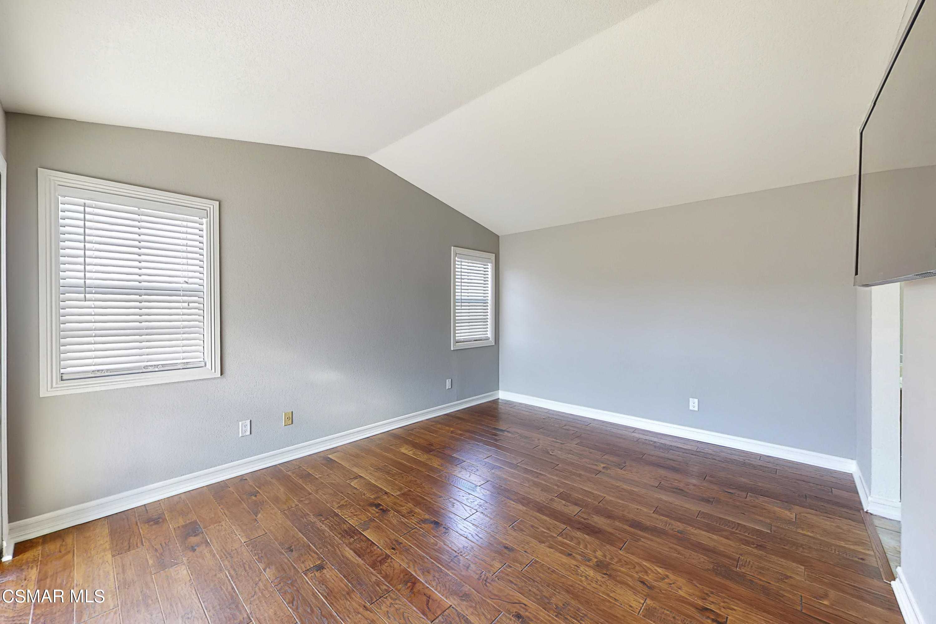 657 Cartpath Place Simi Valley, CA 93065 - Photo 12 of 50 an empty room with wooden floor and windows